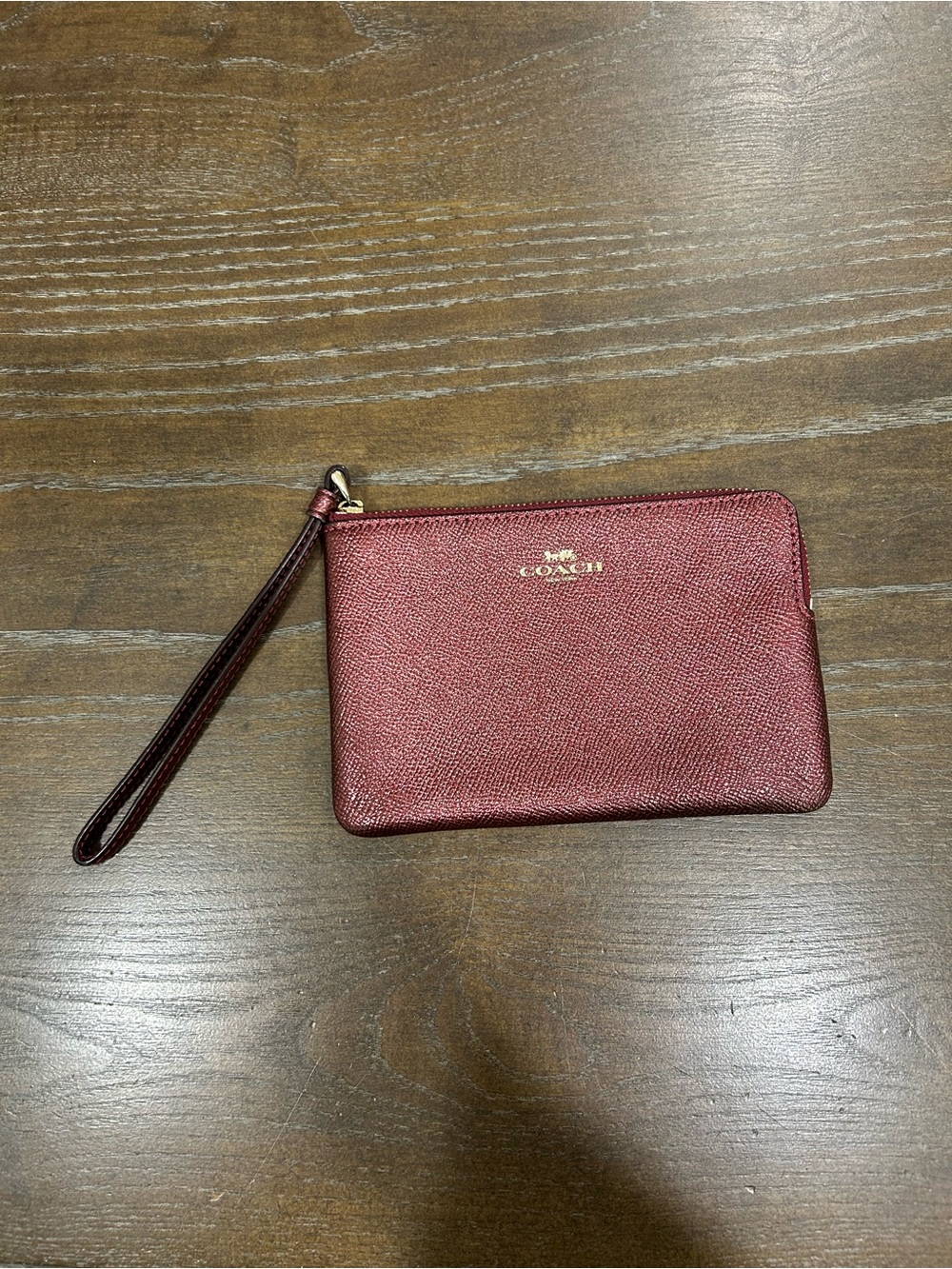 Coach Metallic Maroon Wristlet with Gold Logo